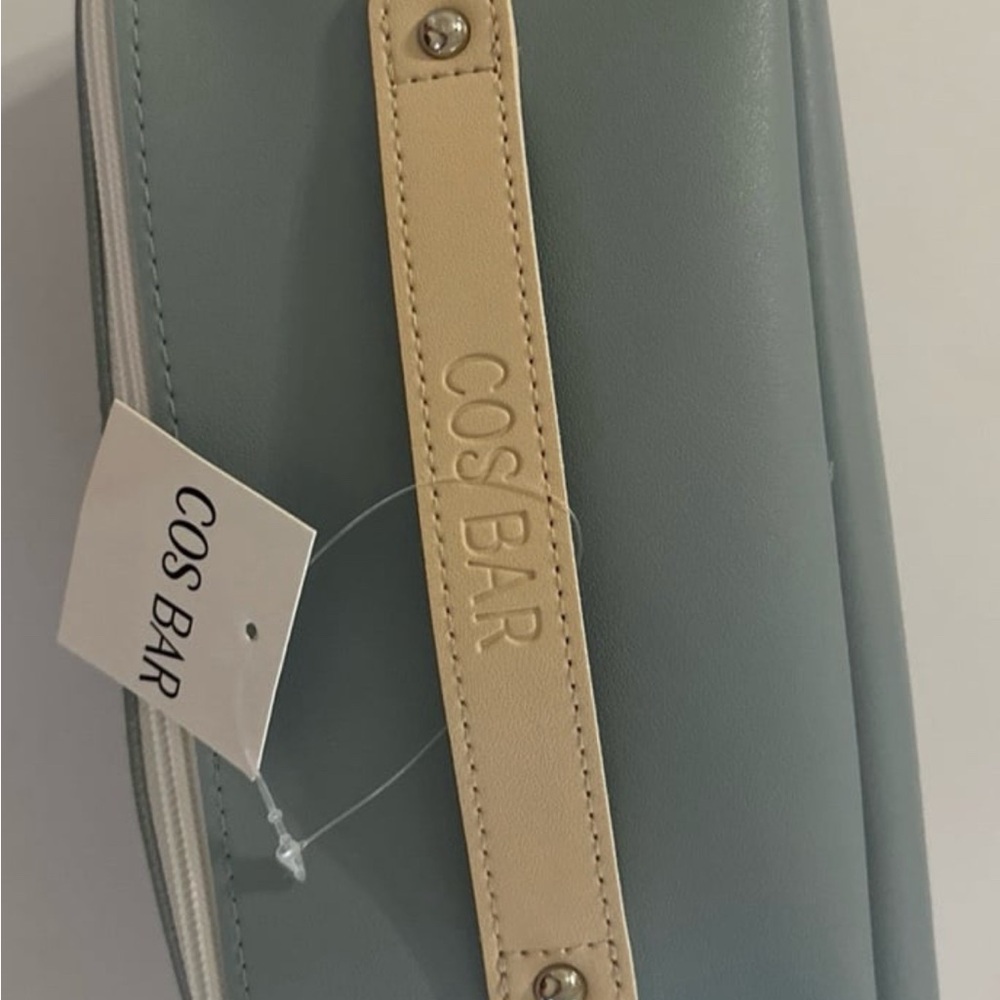 Light blue faux leather beautiful cosmetic bag. NWT.